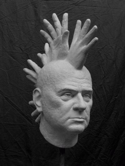 Manly head with cockscomb-shaped hands, plaster, h 60 x 20 x 40, 2011